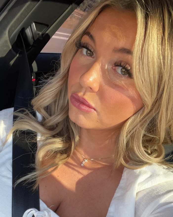 Woman with blonde hair in a car, sharing emotional details about her daughter's violent massacre victim experience. Woman with blonde hair in a car, sharing emotional details about her daughter's violent massacre victim experience.