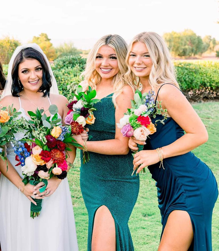 Three women smiling outdoors holding vibrant bouquets, related to massacre victim Kaylee Goncalves’ sister breaking silence. Three women smiling outdoors holding vibrant bouquets, related to massacre victim Kaylee Goncalves’ sister breaking silence.