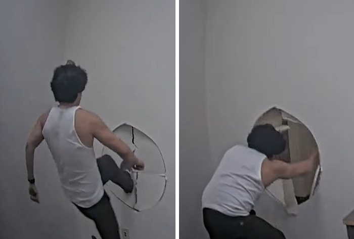 Man in a white tank top breaking through a wall in a tense indoor scene linked to family slaying incident. Man in a white tank top breaking through a wall in a tense indoor scene linked to family slaying incident.