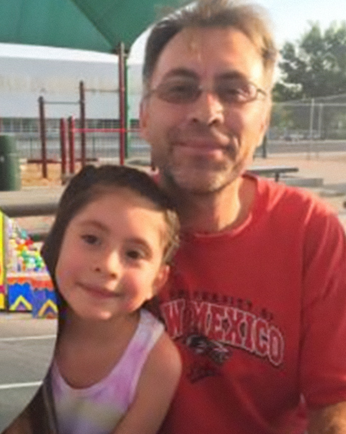 Man and child posing outdoors at a playground, related to man slays entire family and dog news story. Man and child posing outdoors at a playground, related to man slays entire family and dog news story.