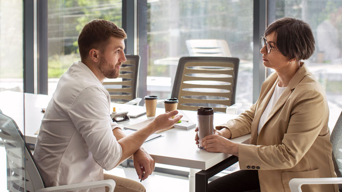 Employee blowing the whistle to expose boss stealing two days of pay during a serious office meeting. Employee blowing the whistle to expose boss stealing two days of pay during a serious office meeting.