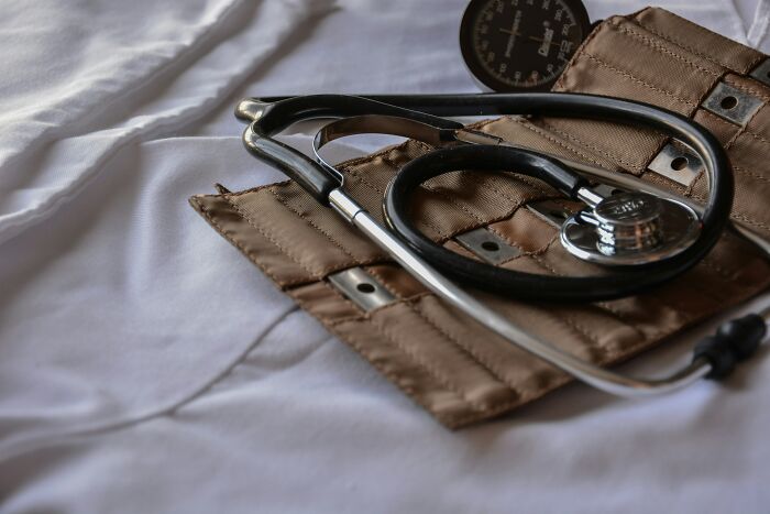 Stethoscope resting on a blood pressure cuff, symbolizing health reasons people share for not divorced.