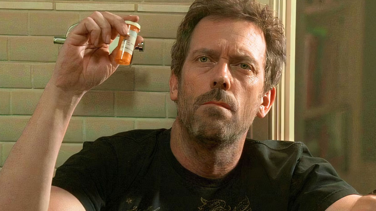 Man examining a small prescription bottle, highlighting differences in European pharmacies from typical US medicine bottles.