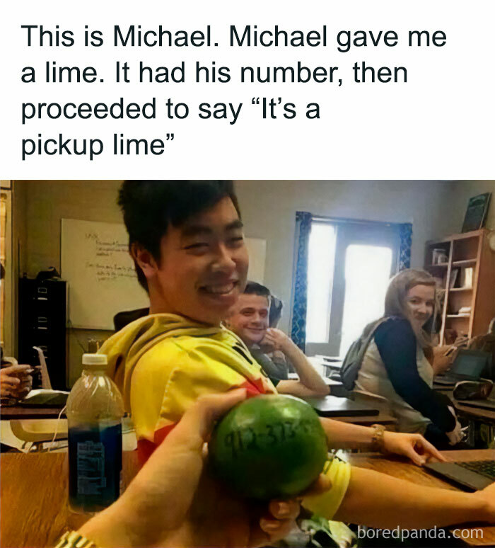 Student smiling in classroom holding lime with a phone number, part of random and chaotic memes that are funny.