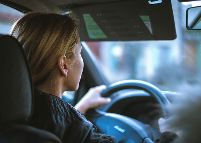Woman battling cancer driving a car, seeking help while dealing with critical family challenges and misunderstandings. Woman battling cancer driving a car, seeking help while dealing with critical family challenges and misunderstandings.
