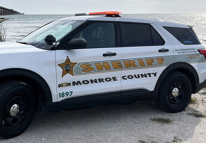 Monroe County sheriff vehicle parked by the water, related to Florida woman attack on driver over chicken incident. Monroe County sheriff vehicle parked by the water, related to Florida woman attack on driver over chicken incident.