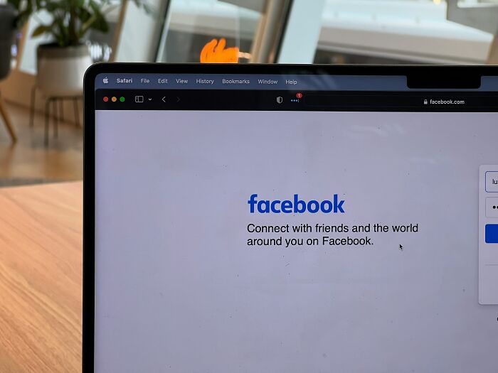 Laptop screen displaying Facebook login page in a cozy room, related to signs netizens say reveal a couple’s days are numbered.