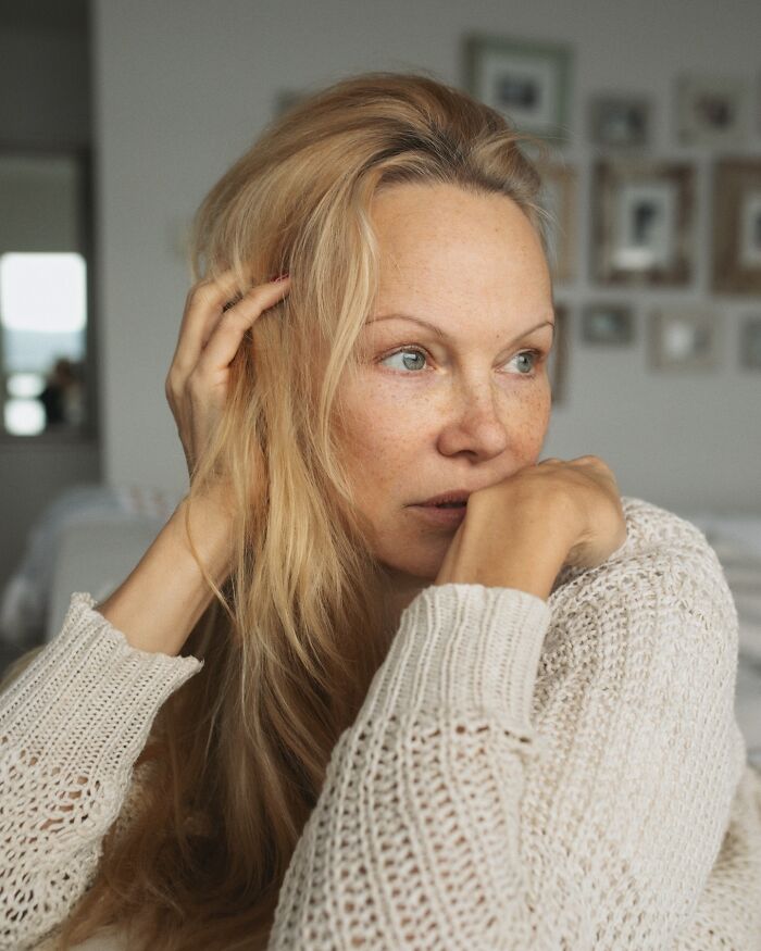 Blonde woman in a white knit sweater looking thoughtful indoors, related to Pamela Anderson dating Liam Neeson news. Blonde woman in a white knit sweater looking thoughtful indoors, related to Pamela Anderson dating Liam Neeson news.