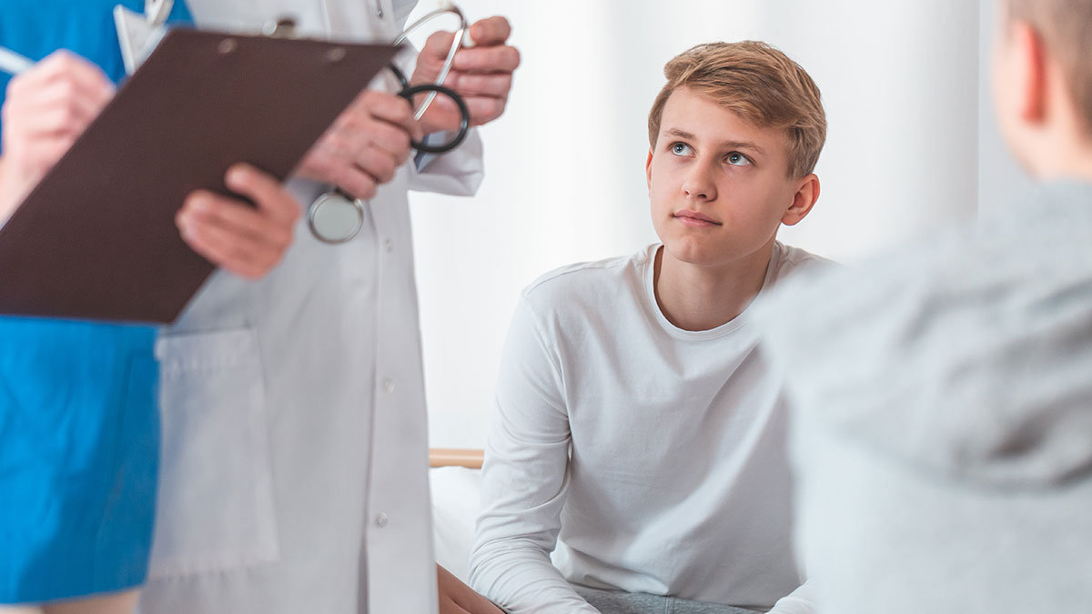 Teen boy learns how much he matters to mom and stepdad during a serious family conversation at home.