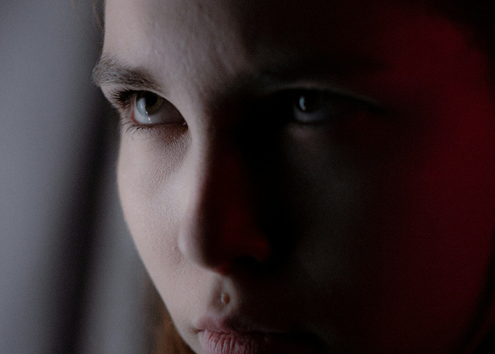 Close-up of a person’s face showing a serious expression, illustrating the impact of savage insults.