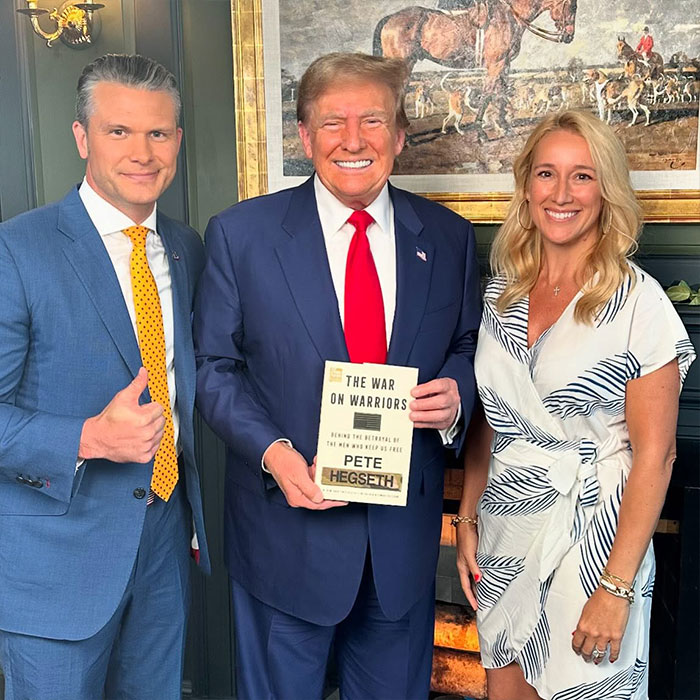 Pete Hegseth posing with two people including Donald Trump, holding his book, highlighting Pete Hegseth’s net worth and public image.