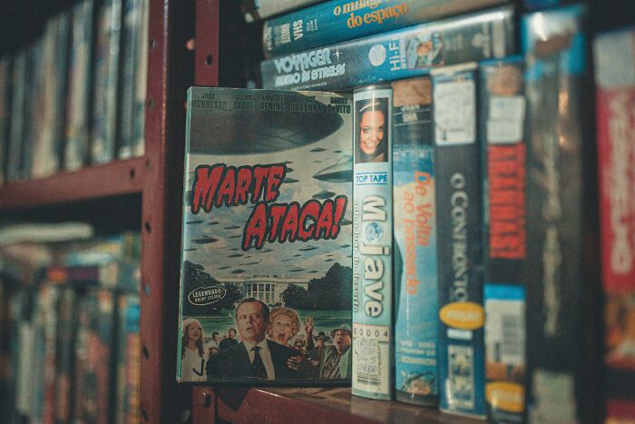 Close-up of vintage movie VHS tapes on a shelf, highlighting famous movie titles for IMDb memory challenge fans. Close-up of vintage movie VHS tapes on a shelf, highlighting famous movie titles for IMDb memory challenge fans.