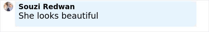 Comment from Souzi Redwan saying she looks beautiful in black and bold text on a light blue background. Comment from Souzi Redwan saying she looks beautiful in black and bold text on a light blue background.