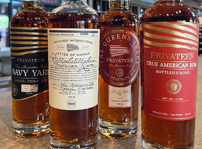 Bottles of Privateer rum on a bar counter, unrelated to Coldplay cheating scandal HR executive SEO keywords. Bottles of Privateer rum on a bar counter, unrelated to Coldplay cheating scandal HR executive SEO keywords.