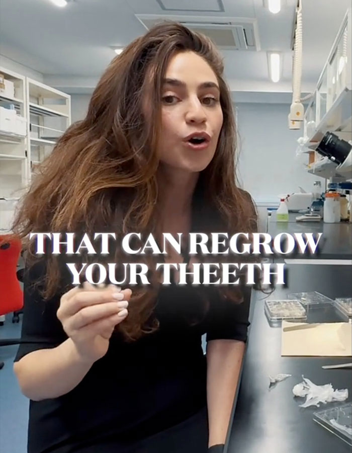 Female scientist in lab explaining the breakthrough in tooth regrowth that may replace dentures and implants. Female scientist in lab explaining the breakthrough in tooth regrowth that may replace dentures and implants.