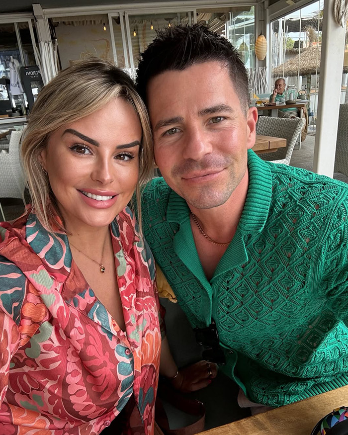 Rhian Sugden smiling with a male companion at a restaurant amid fan backlash over $13K plastic surgery incident. Rhian Sugden smiling with a male companion at a restaurant amid fan backlash over $13K plastic surgery incident.