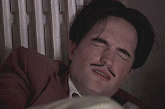 Robert Pattinson with eyes closed and mustache, portraying a challenging Twilight intimate scene moment. Robert Pattinson with eyes closed and mustache, portraying a challenging Twilight intimate scene moment.
