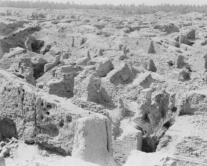 Ancient archaeological site with eroded ruins, linked to scientists deciphering 3,000-year-old text revealing women's roles.