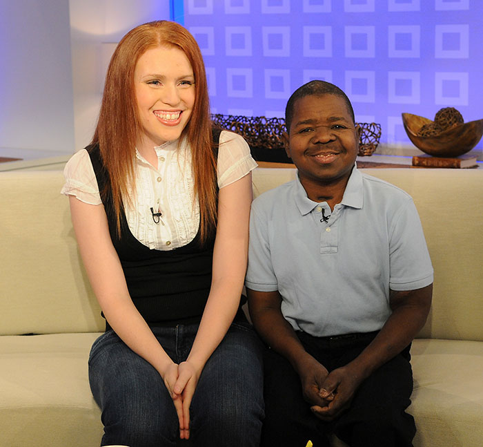 Shannon Price and Gary Coleman sitting on a couch during a televised interview discussing personal matters. Shannon Price and Gary Coleman sitting on a couch during a televised interview discussing personal matters.
