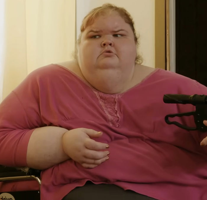 Tammy Slaton from 1000-Lb Sisters showing skin removal surgery results wearing a pink top and sitting in a wheelchair Tammy Slaton from 1000-Lb Sisters showing skin removal surgery results wearing a pink top and sitting in a wheelchair