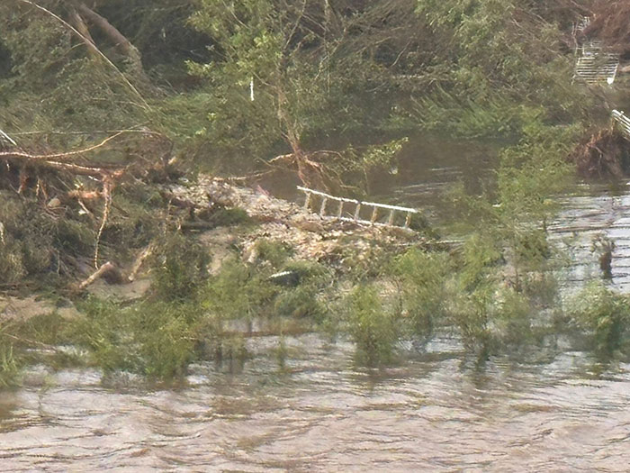Flooded Texas landscape with debris and a damaged ladder, representing sisters who lost their lives in Texas floods. Flooded Texas landscape with debris and a damaged ladder, representing sisters who lost their lives in Texas floods.