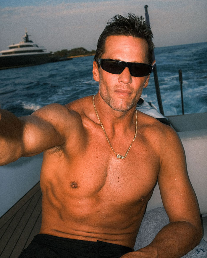 Tom Brady shirtless on a boat wearing sunglasses, highlighting his summer romance and playful vibe with Sofia Vergara. Tom Brady shirtless on a boat wearing sunglasses, highlighting his summer romance and playful vibe with Sofia Vergara.
