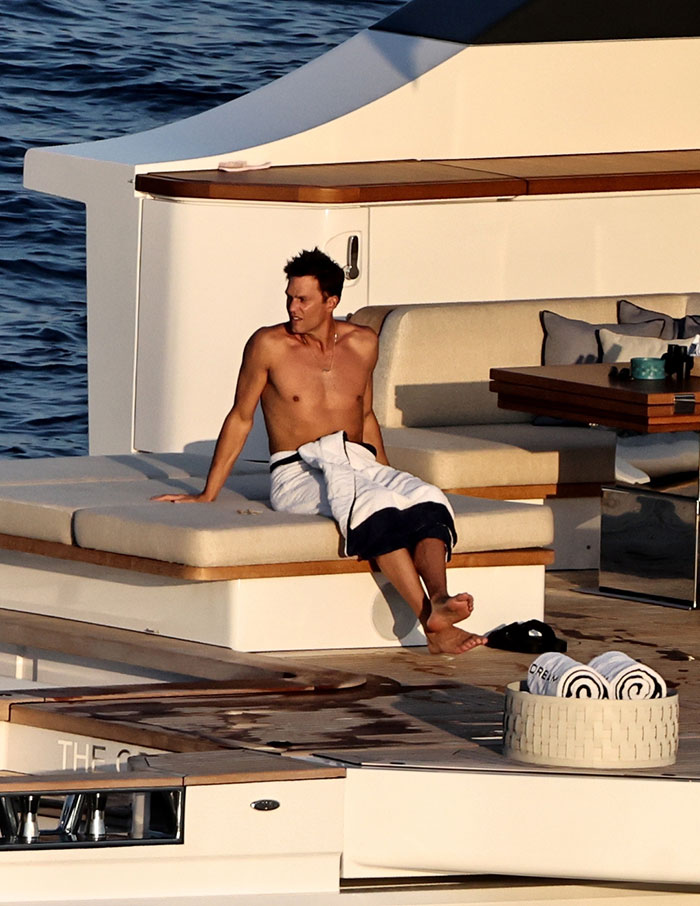 Tom Brady relaxing shirtless on a yacht during summer, linked to Sofía Vergara's summer romance sparking spice reactions. Tom Brady relaxing shirtless on a yacht during summer, linked to Sofía Vergara's summer romance sparking spice reactions.