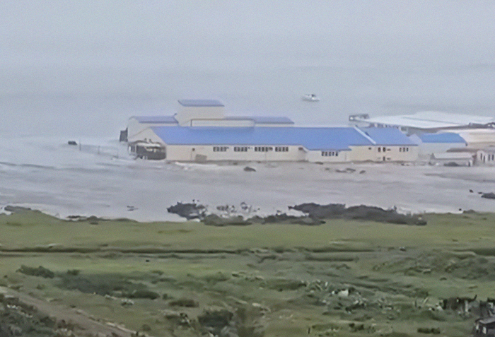 Tsunami waves inundate coastal buildings in Alaska and Japan following mega earthquake warning alerts. Tsunami waves inundate coastal buildings in Alaska and Japan following mega earthquake warning alerts.