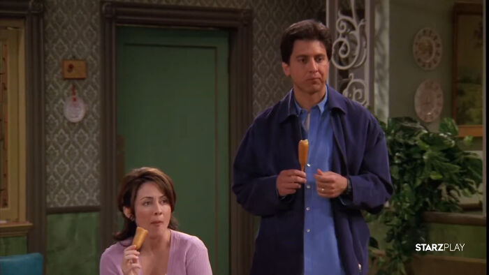 Two characters from a show eating corn dogs, representing shows with characters that are hard to love.