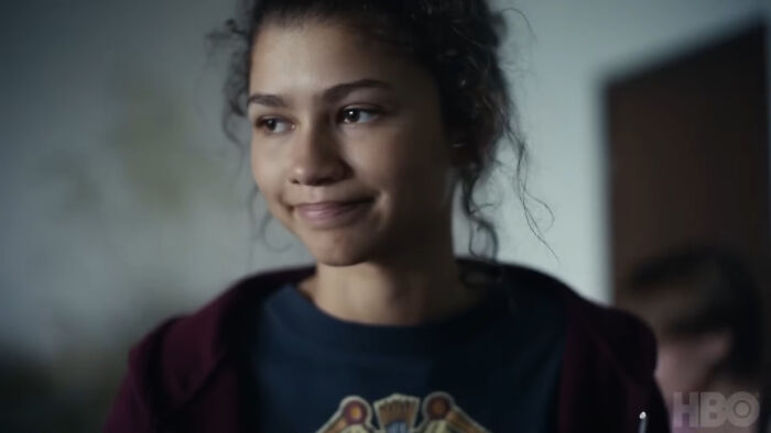 Young woman with a thoughtful expression, representing characters that are very hard to love in TV shows.