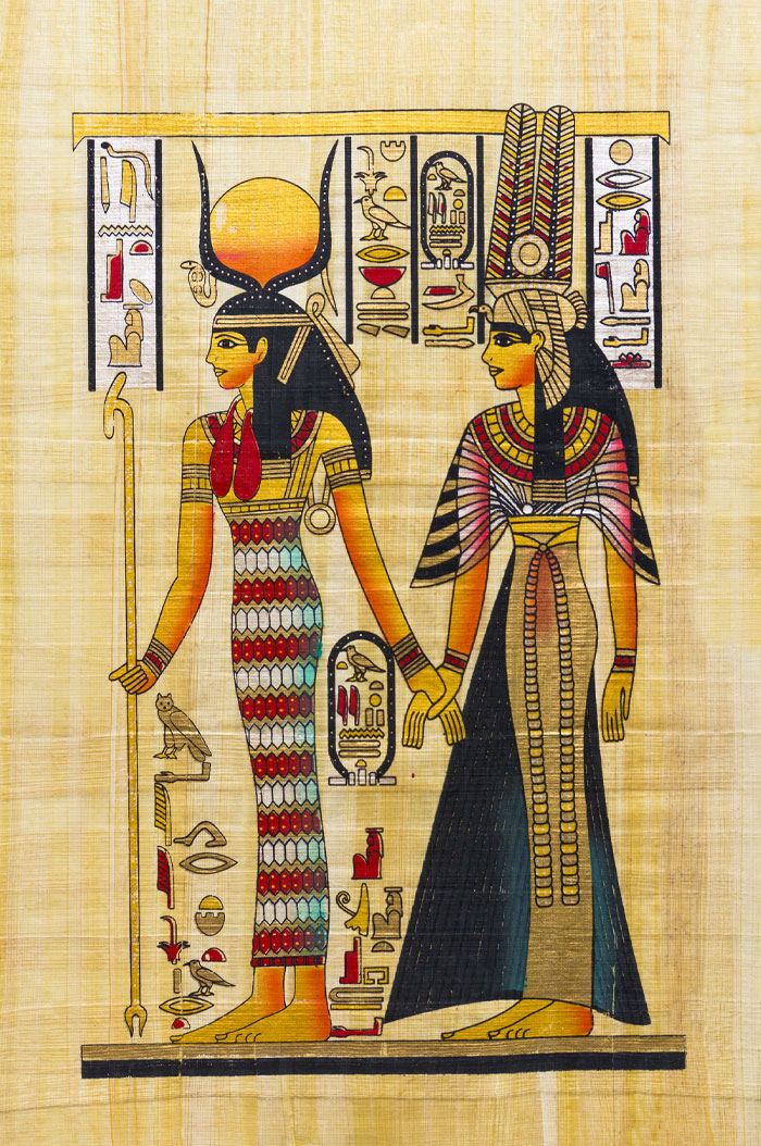 Ancient Egyptian artwork depicting two women with detailed clothing and hieroglyphs, highlighting very rare boy names.