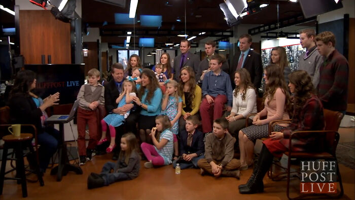 A teacher and students gathered in a studio setting, highlighting truly outrageous student names shared by a teacher.