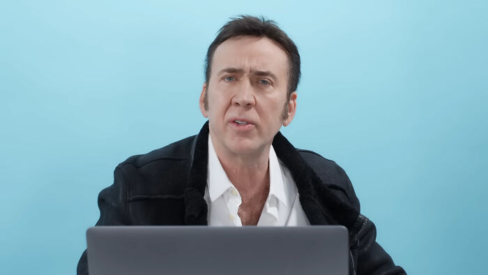 Actor sitting in front of a laptop, representing celebrities that many people love but can't stand online discussions.