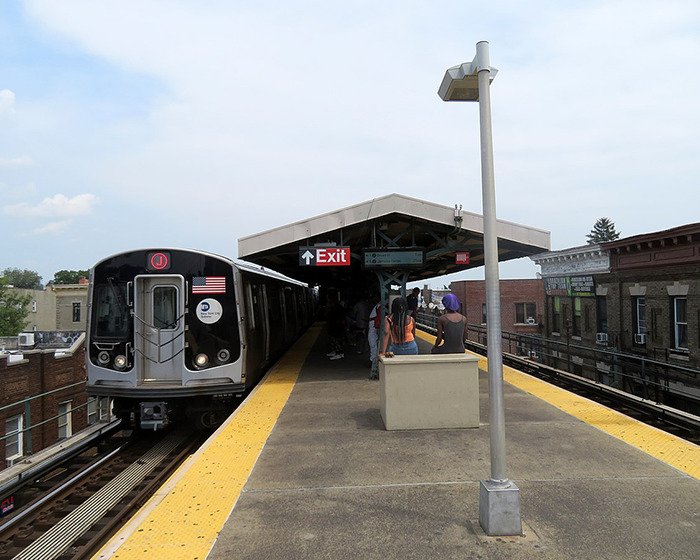 Subway platform showing a train arriving with people waiting, related to men delivering vigilante justice after an attack. Subway platform showing a train arriving with people waiting, related to men delivering vigilante justice after an attack.