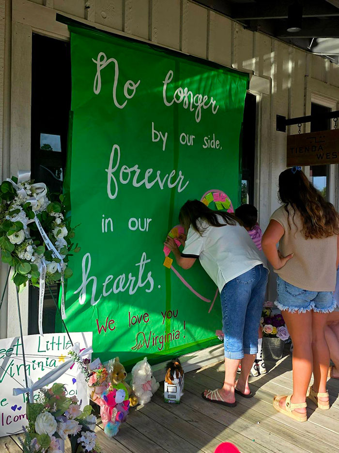 People leave messages at a memorial with flowers and stuffed animals after Camp Mystic tragedy involving 8-year-old's horse. People leave messages at a memorial with flowers and stuffed animals after Camp Mystic tragedy involving 8-year-old's horse.