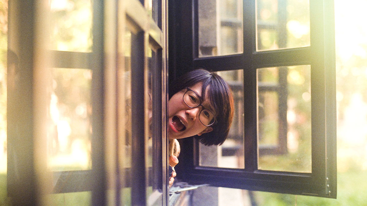 Woman with glasses peeking and shouting out of an open window, symbolizing coworker moves in and demands rides.
