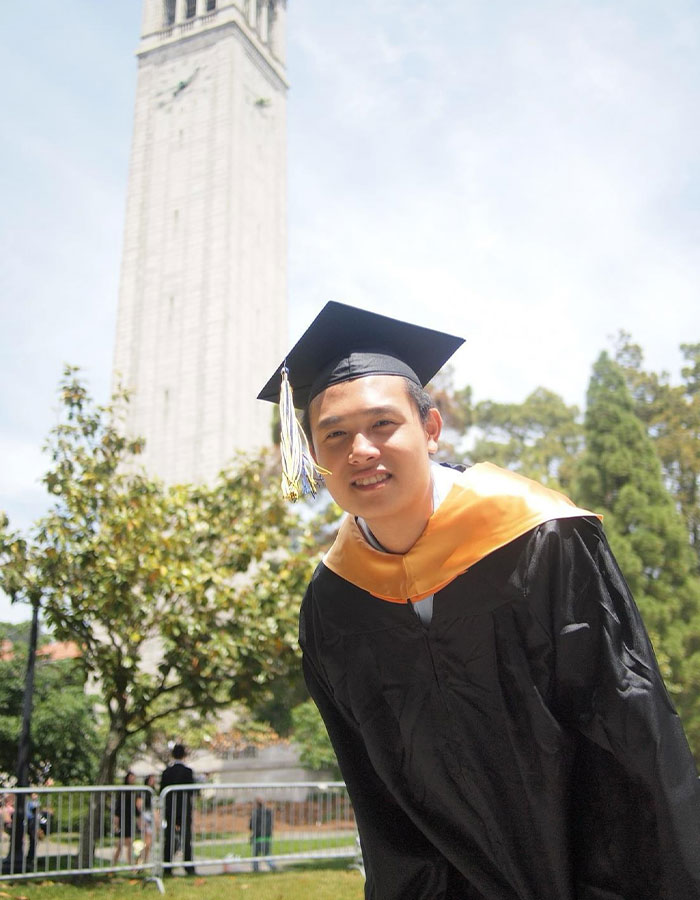 Image shows a young man in a graduation cap and gown smiling outdoors, unrelated to vaping on plane incident. Image shows a young man in a graduation cap and gown smiling outdoors, unrelated to vaping on plane incident.