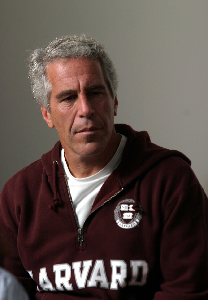 Epstein in a maroon Harvard hoodie, sitting indoors, representing the Epstein Island allegations context for Stephen Hawking fact separation. Epstein in a maroon Harvard hoodie, sitting indoors, representing the Epstein Island allegations context for Stephen Hawking fact separation.