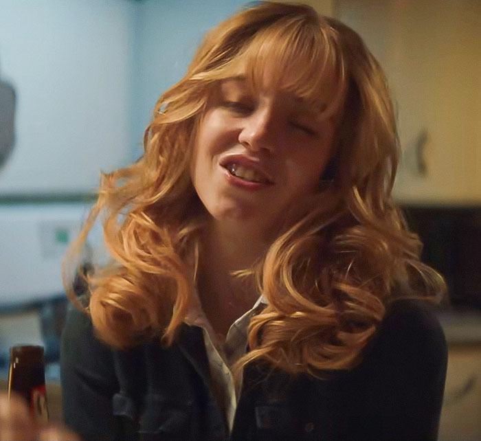 Sydney Sweeney with long curly hair in a casual setting reacting emotionally amid social media trolling controversy. Sydney Sweeney with long curly hair in a casual setting reacting emotionally amid social media trolling controversy.