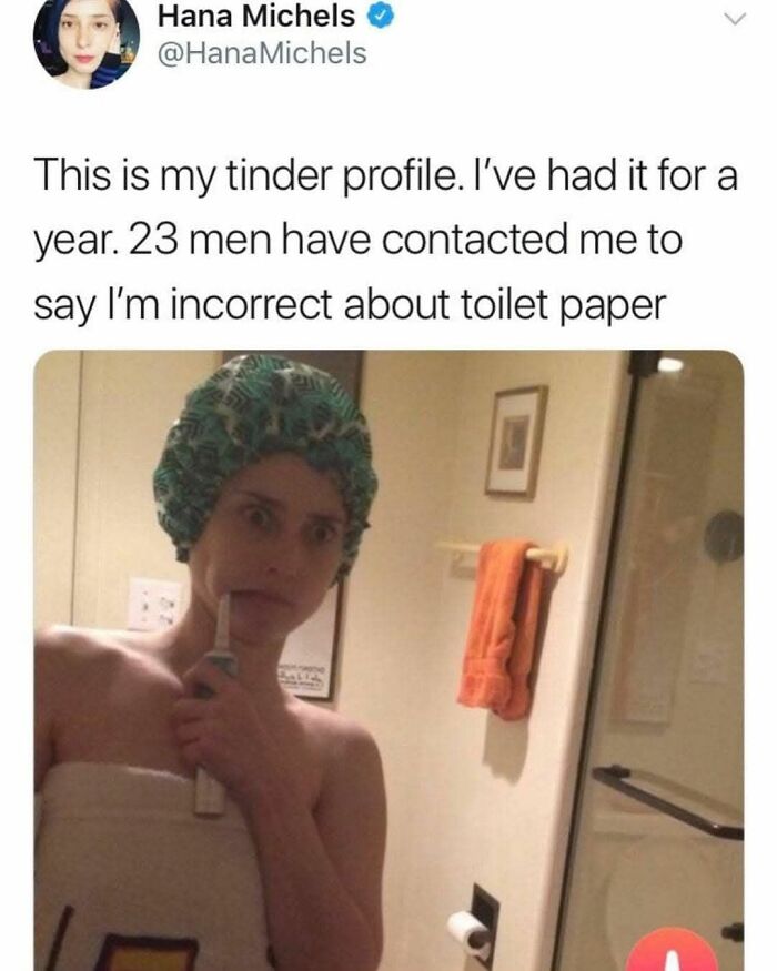 Woman wrapped in towel and shower cap holding toothbrush, representing overconfident know-it-alls incorrectly correcting facts.