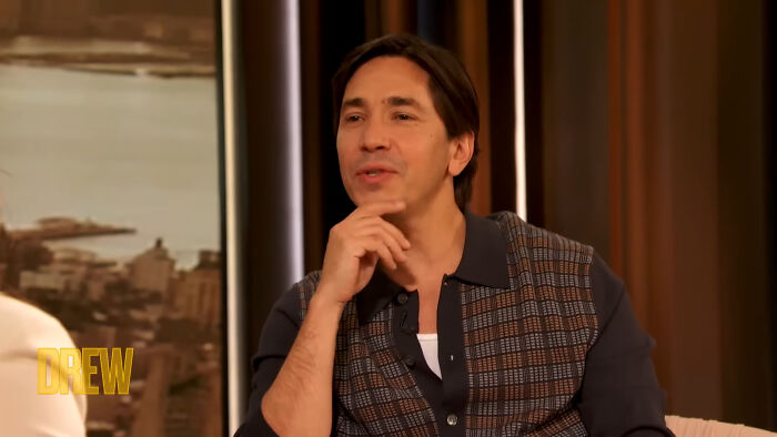 Actor sitting thoughtfully on a talk show set, representing celebrities Hollywood tried to make leading A-listers.