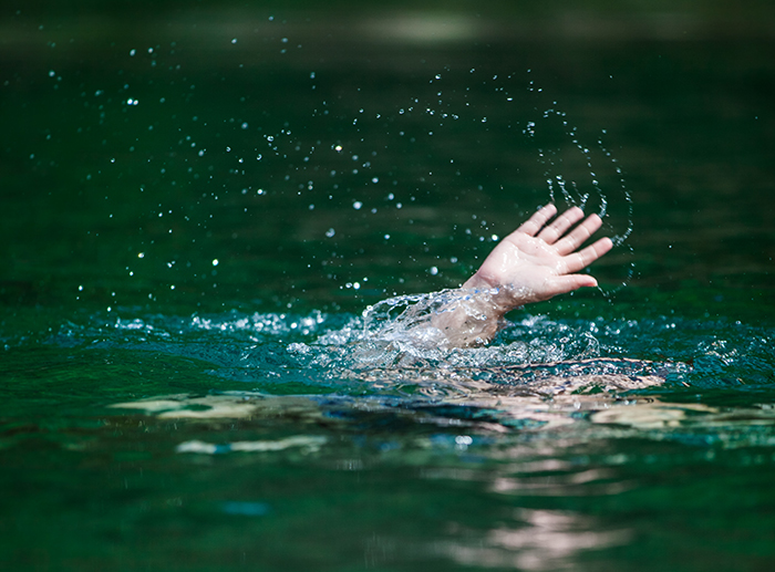 Hand reaching out of water, symbolizing a woman shocked to find out her mother-in-law hates her after losing husband. Hand reaching out of water, symbolizing a woman shocked to find out her mother-in-law hates her after losing husband.