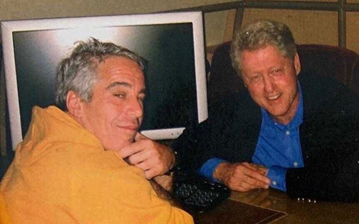 Jeffrey Epstein and Bill Clinton sitting together in a casual setting, linked to Epstein jail video missing minutes and DOJ claims. Jeffrey Epstein and Bill Clinton sitting together in a casual setting, linked to Epstein jail video missing minutes and DOJ claims.