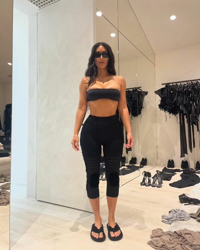 Kim Kardashian in a black outfit and sunglasses standing in a room, related to Anthony Hopkins Hannibal Lecter parody. Kim Kardashian in a black outfit and sunglasses standing in a room, related to Anthony Hopkins Hannibal Lecter parody.