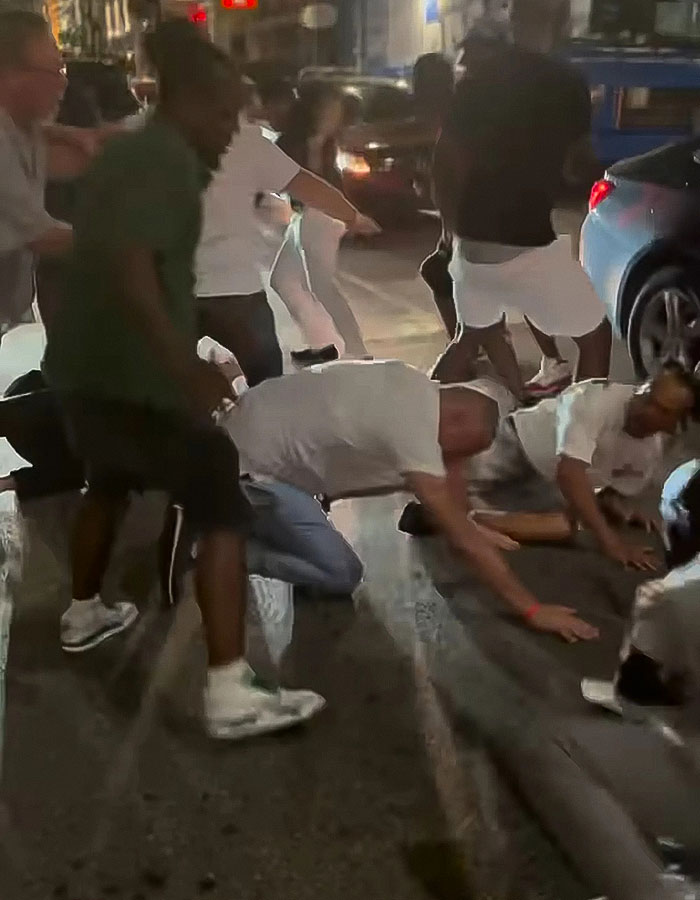 People involved in a violent Cincinnati brawl with a mom knocked out, shown on the ground during a chaotic street fight. People involved in a violent Cincinnati brawl with a mom knocked out, shown on the ground during a chaotic street fight.