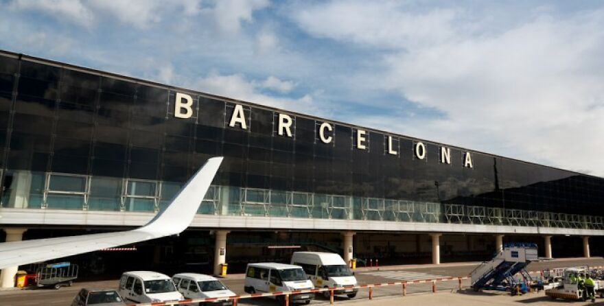 Barcelona airport exterior with airplanes and vehicles, illustrating a home alone vibes scene at the airport. Barcelona airport exterior with airplanes and vehicles, illustrating a home alone vibes scene at the airport.
