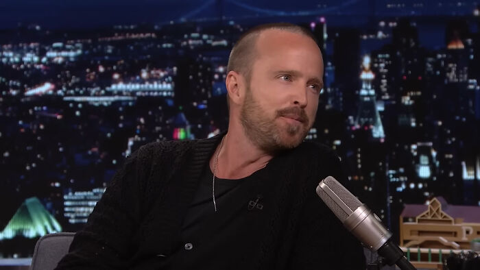 Actor Aaron Paul in a late-night talk show interview, discussing Hollywood celebrities and their rise to A-listers.