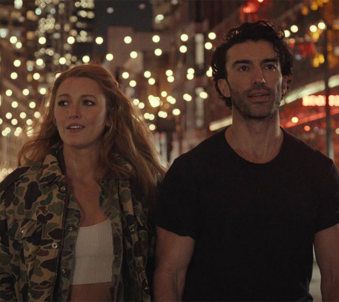 Blake Lively and co-star walking through a lit street scene from the new rom-com leading role film. Blake Lively and co-star walking through a lit street scene from the new rom-com leading role film.