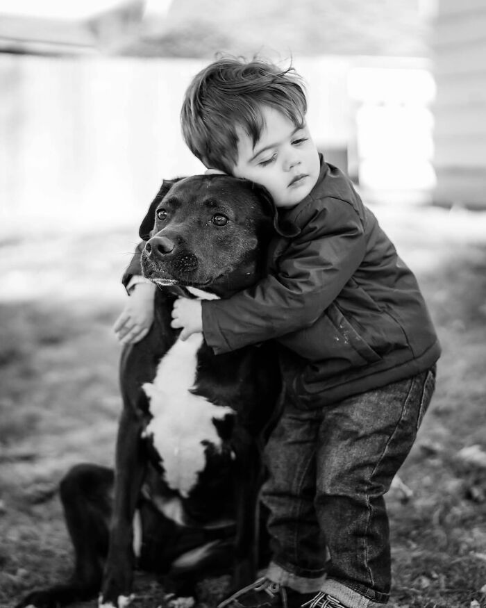 Woman embracing and kissing her dog, capturing a touching final moment between pets and their humans.