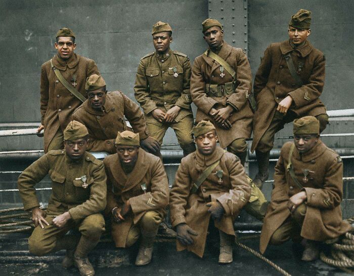 Group of African American soldiers in 1920s military uniforms, colorized photo showing historical reality of the era.